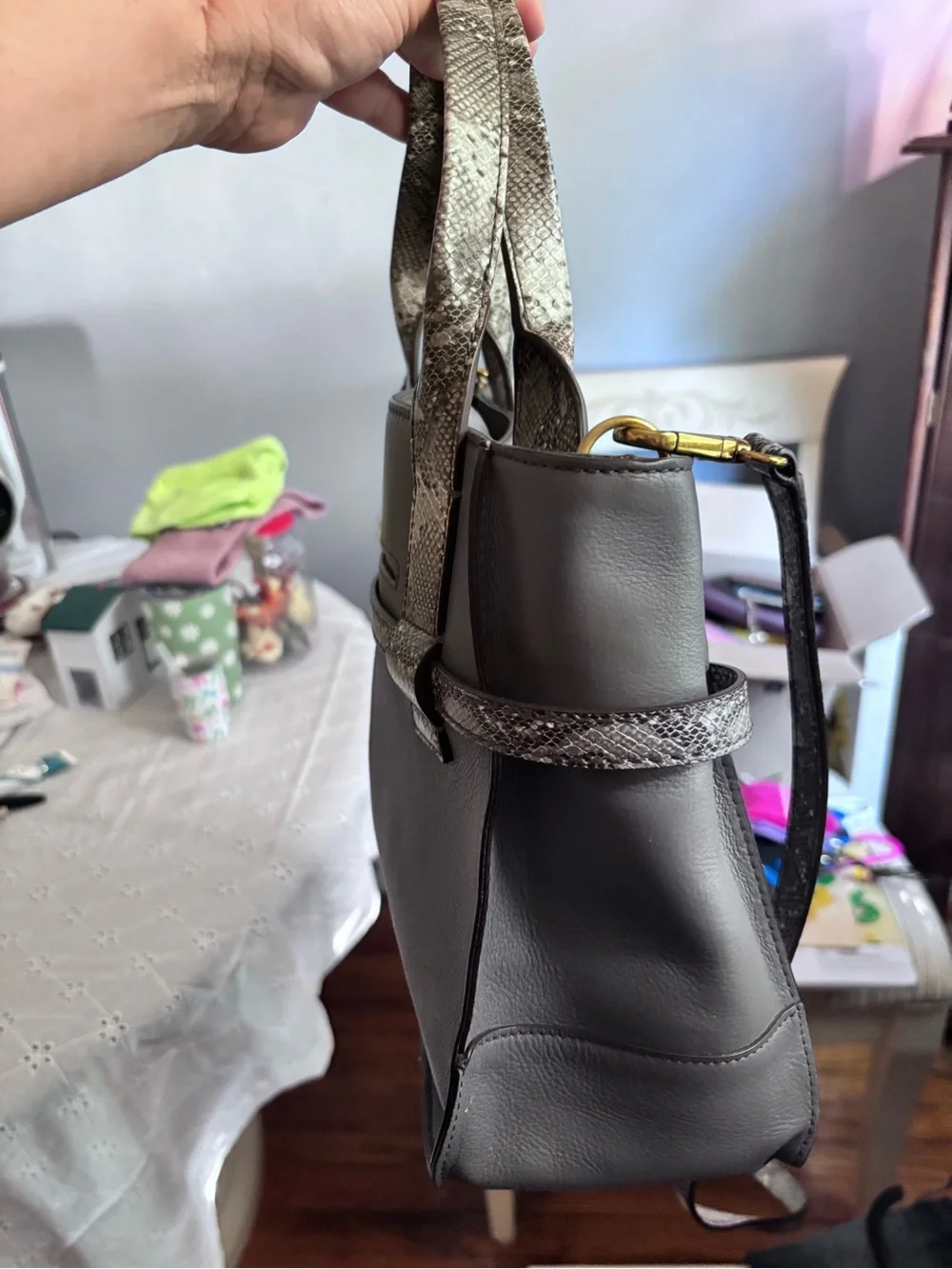 Fossil Willow satchel in gray leather, highlighted by a distinctive snake-print